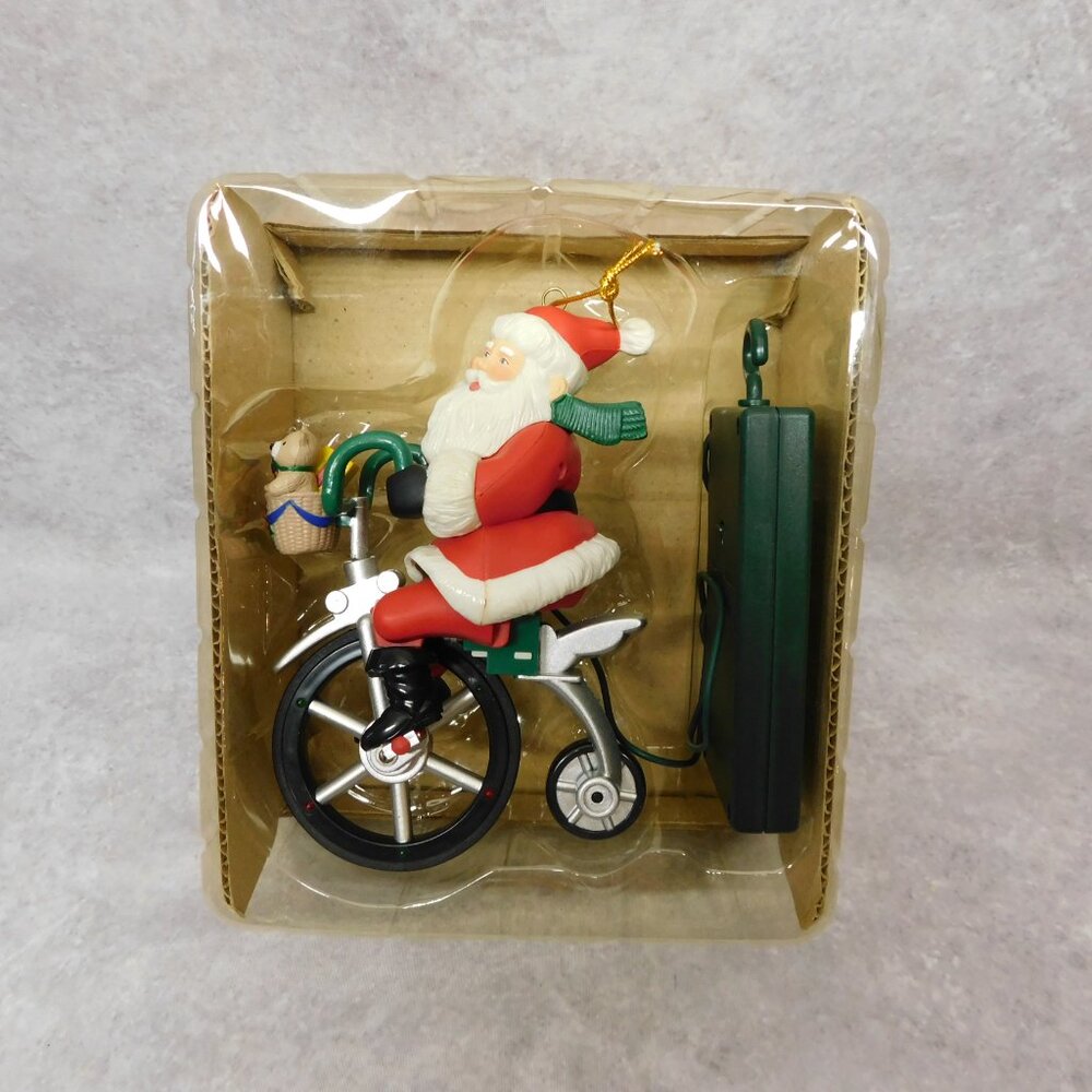 Animated Musical Lighted Santa Claus Riding a Bicycle Christmas Tree Ornament